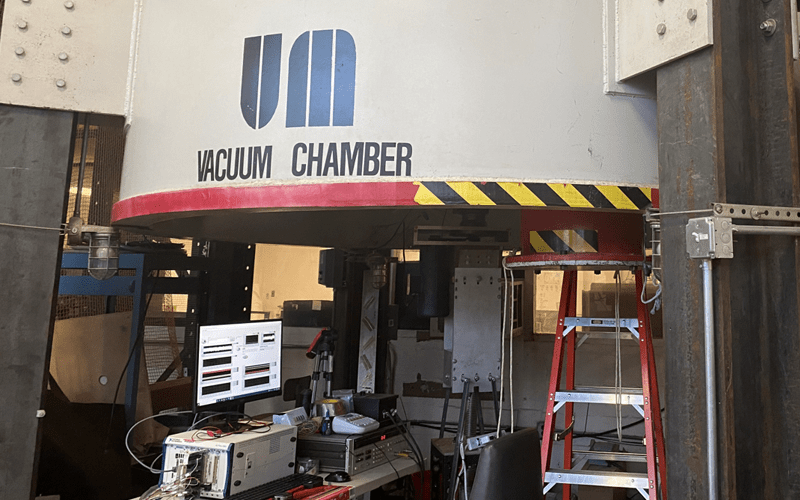 Exterior of Maryland's Vacuum Chamber with a monitor display beneath