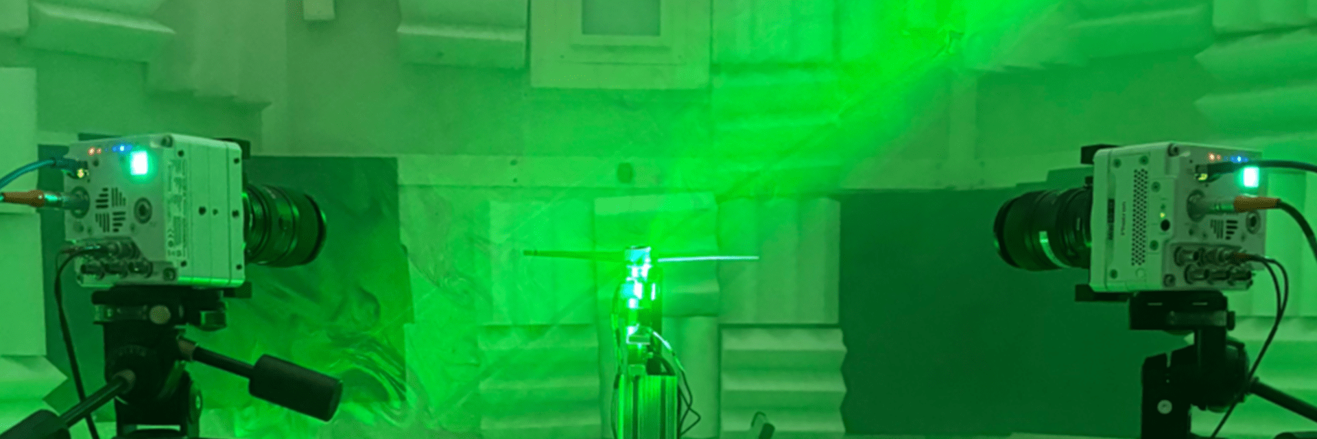 two cameras pointed at a test model in the aeroacoustics chamber